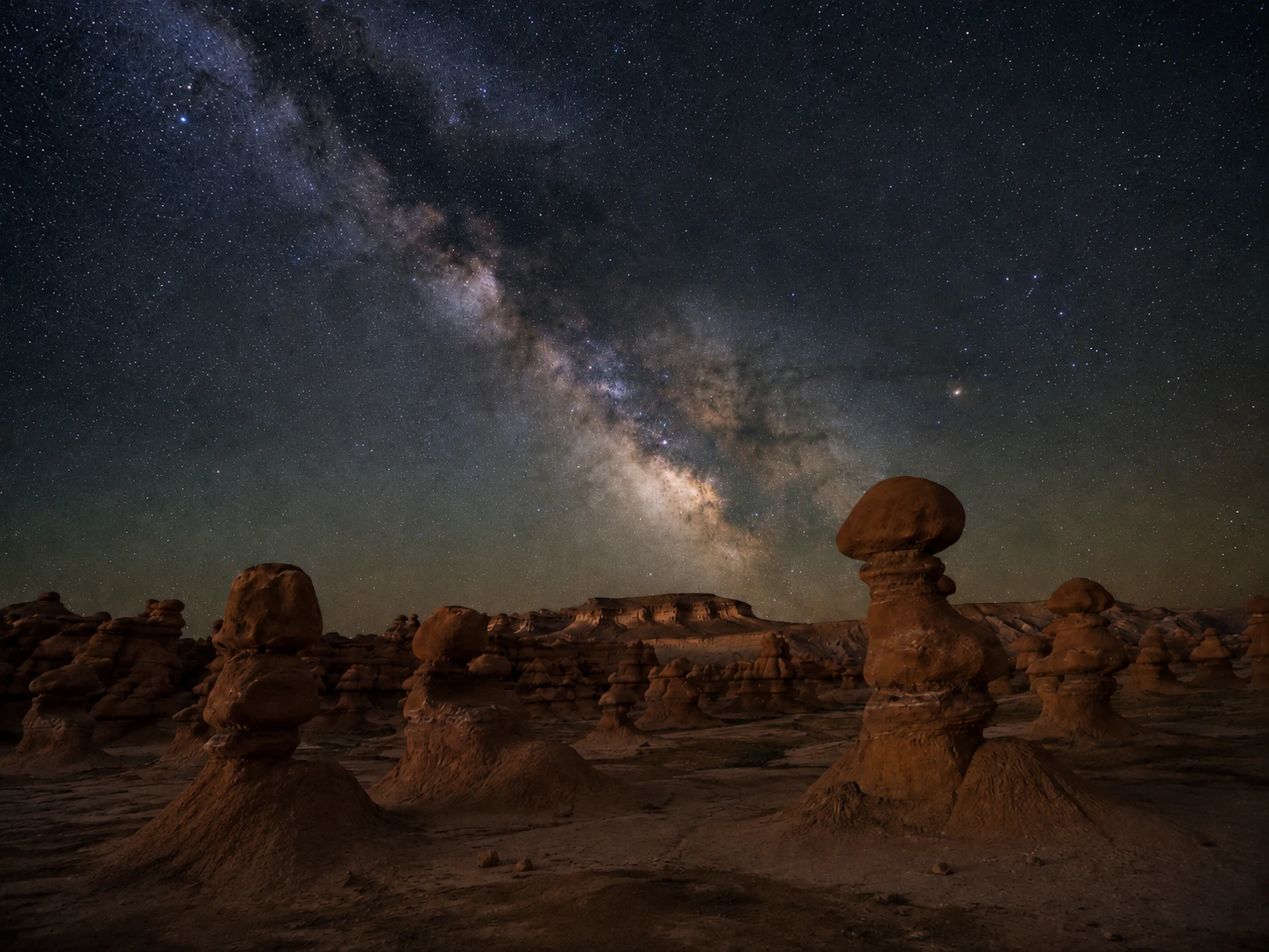 Milky Way above sandstone hoodoos in Goblin Valley at night